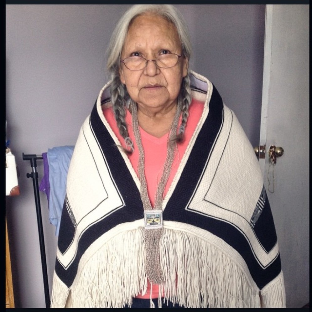 Our Haida and Kwakwaka'wakw family matriarch, Minnie Johnston, wear Salmon Berry Ancestor Pendant and Sky Blanket, 2015